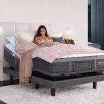 Model reading book on Sealy Adjustable bed base