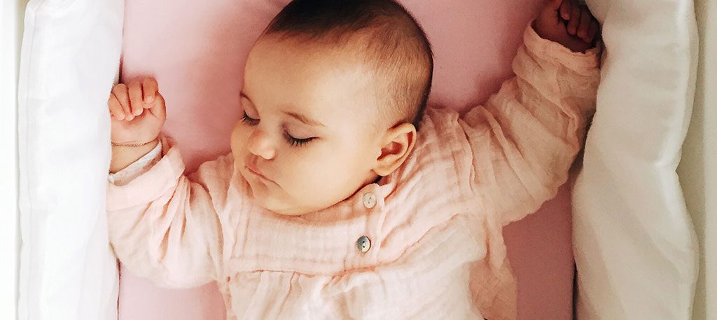 baby asleep in crib