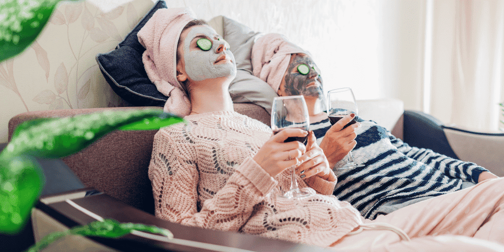 canva-mother-daughter-face-masks-while-drinking-wine