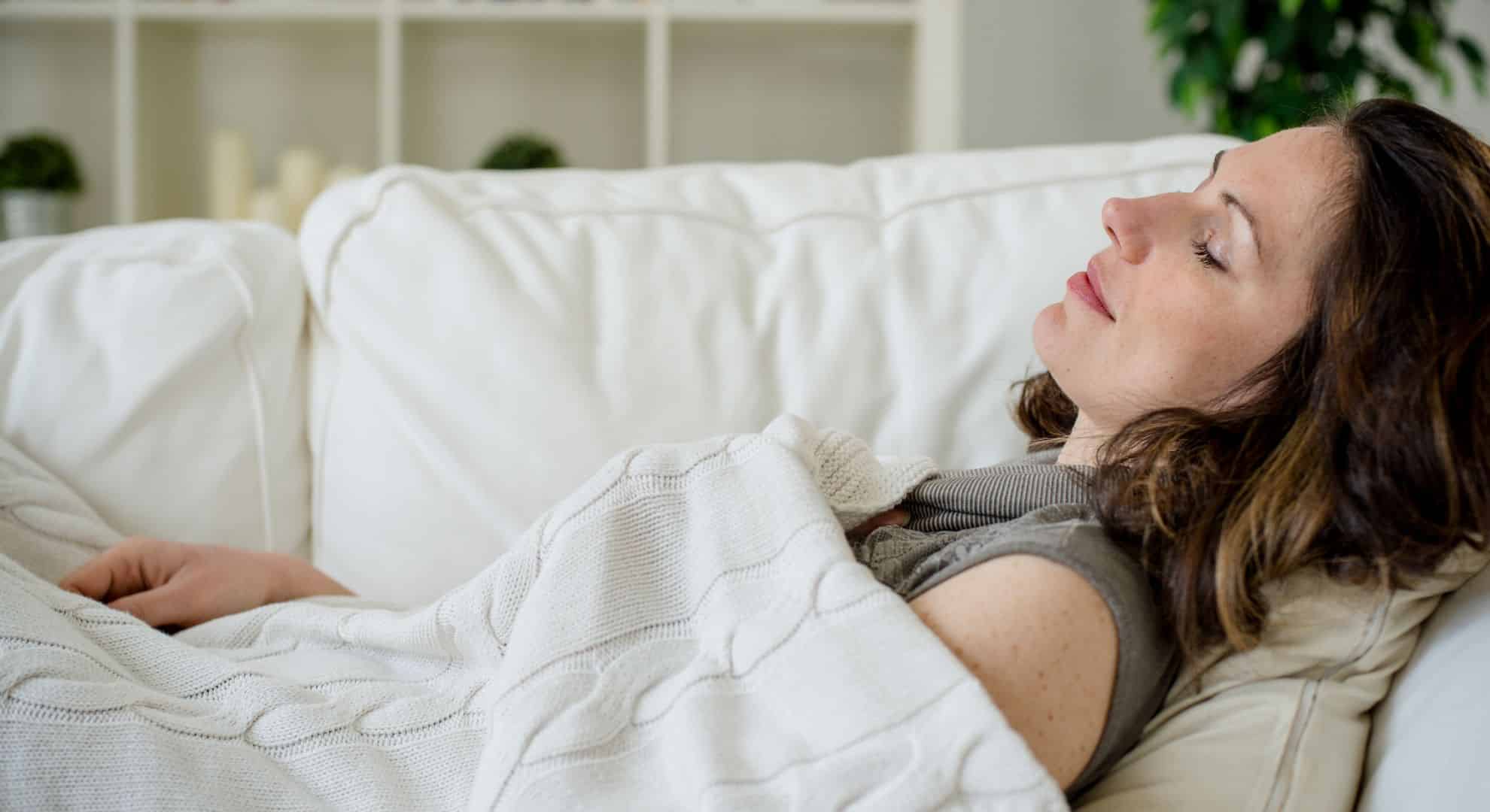 Woman napping on couch