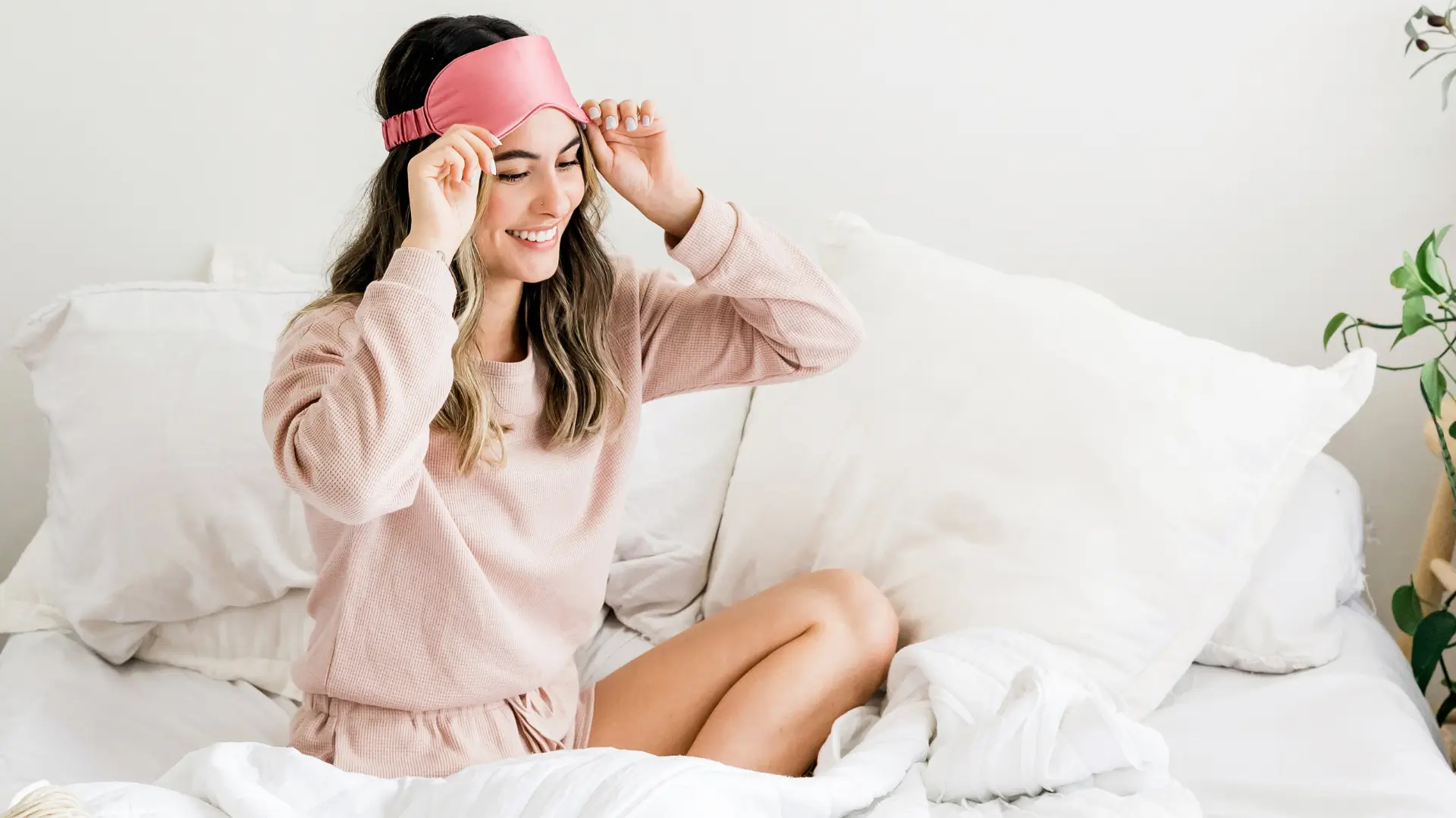 Woman happy awake in bed