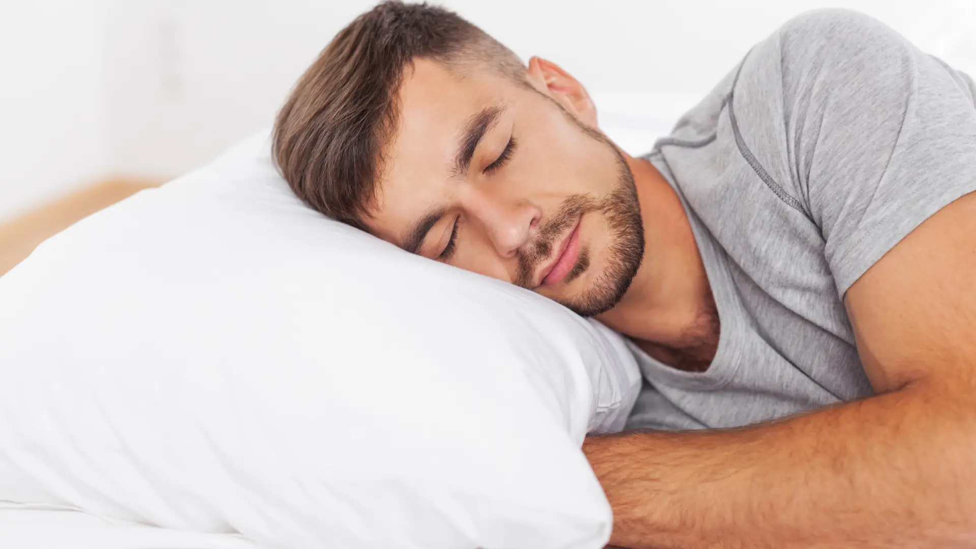 Man sleeping comfortable in bed