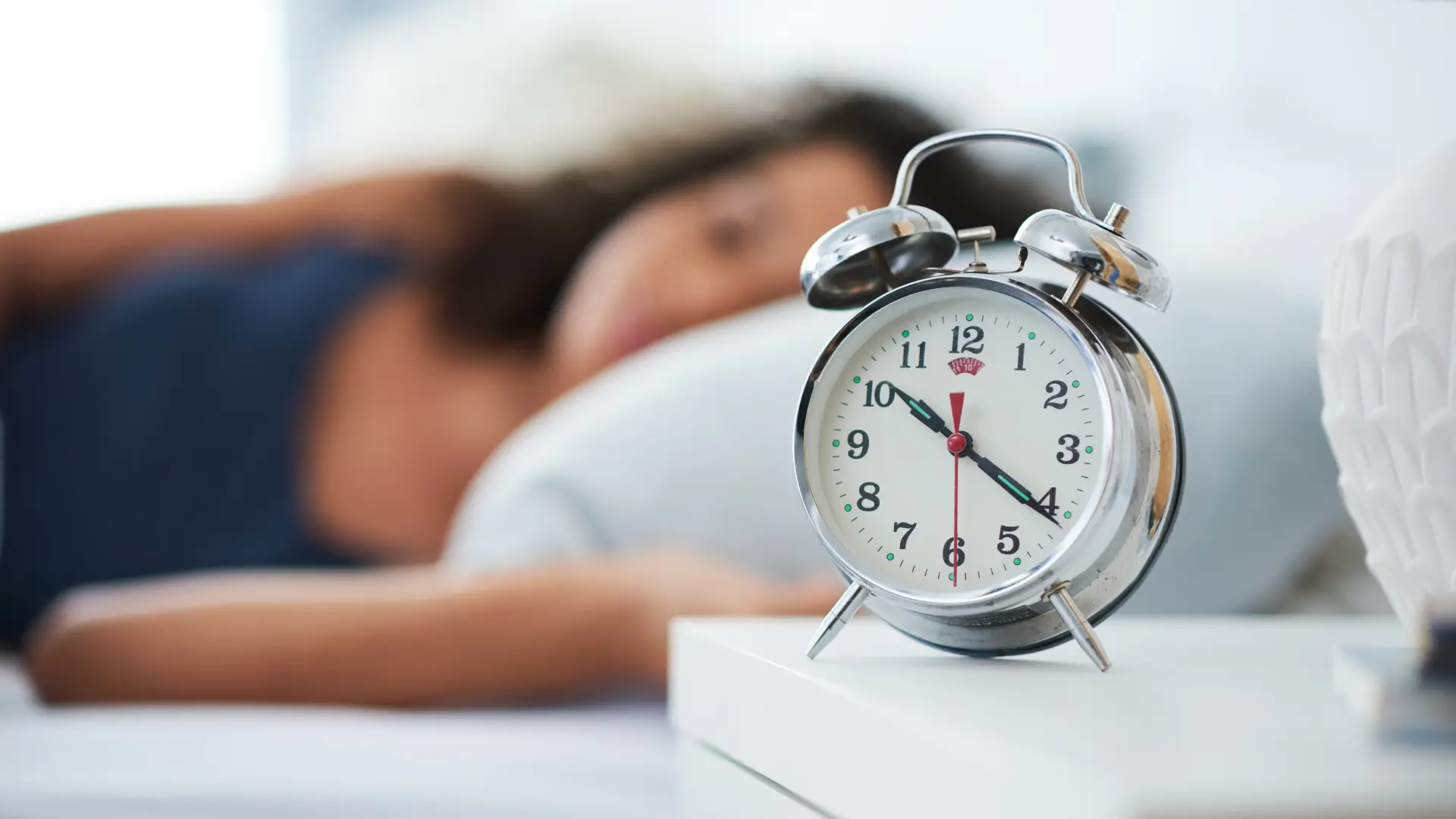 Woman sleeping alarm clock