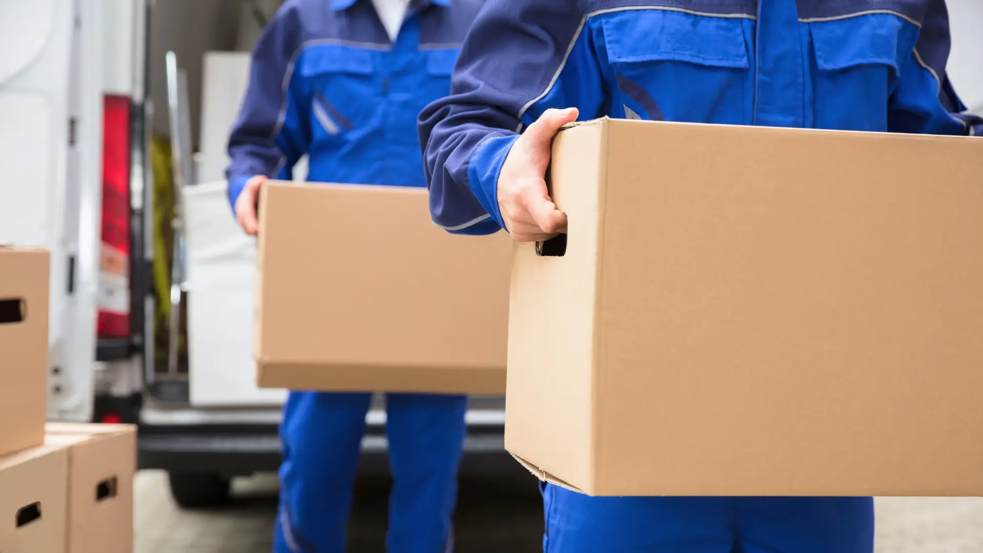 Movers lifting boxes