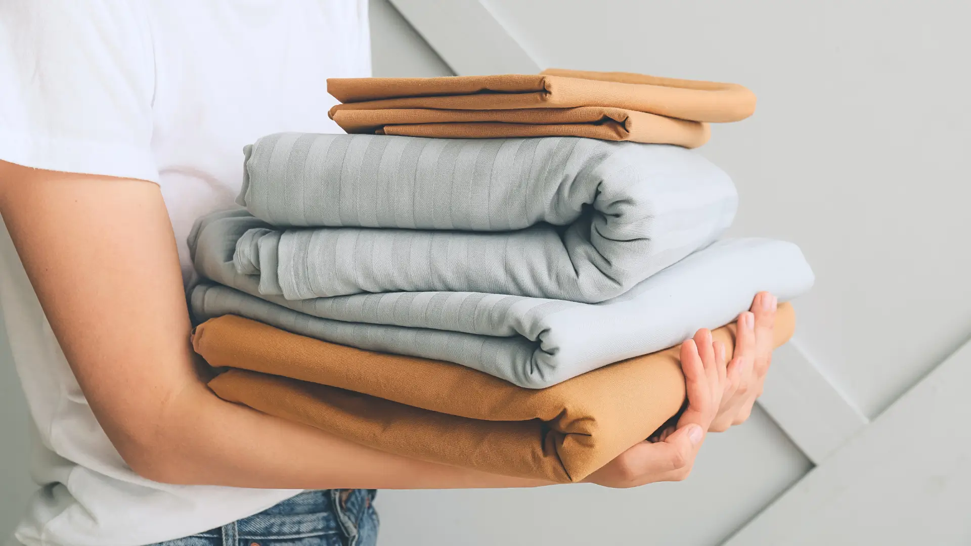 Woman holding sheets